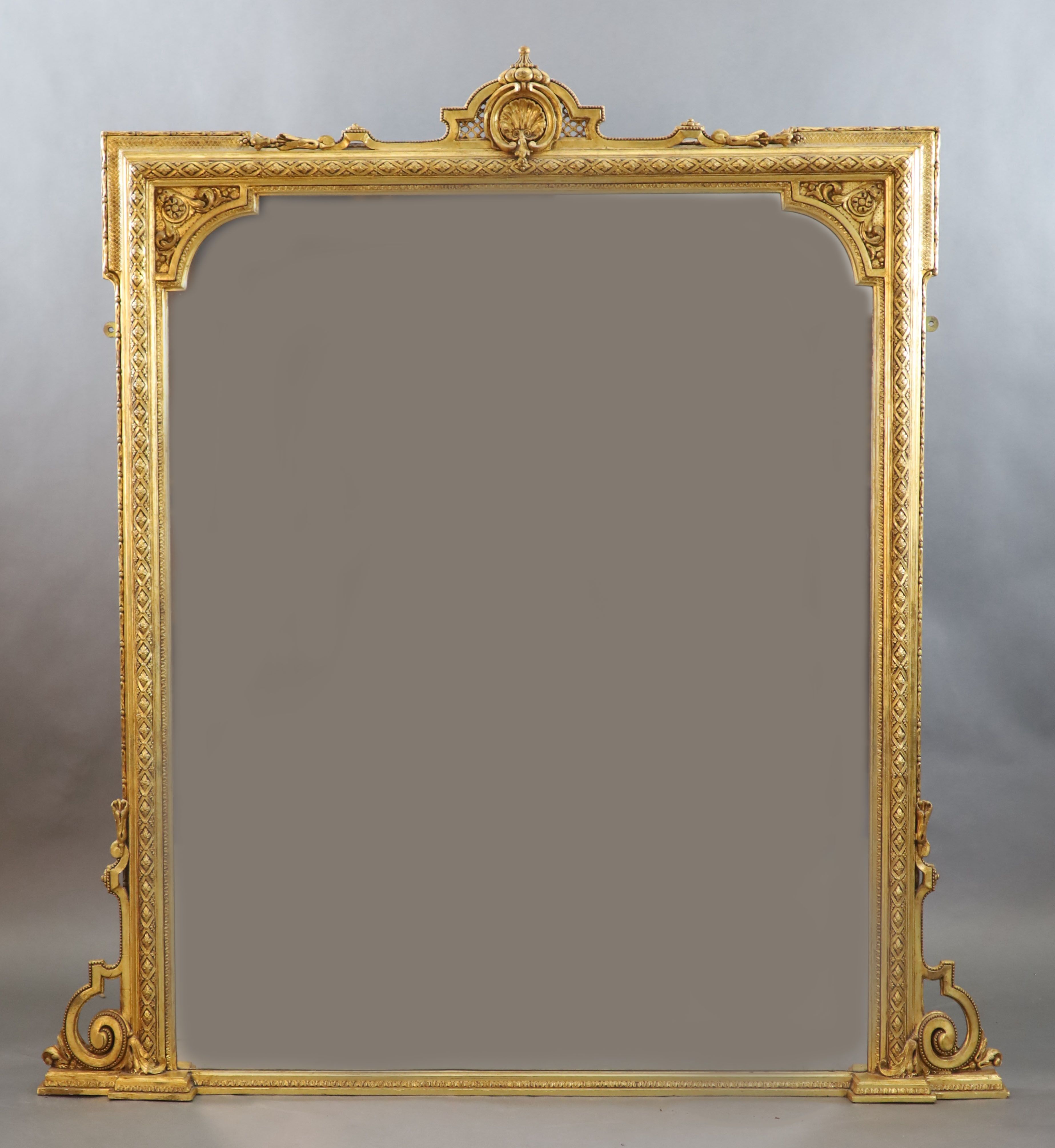 A Victorian gilt gesso overmantel W. 4ft. 6in. H.4ft. 10in.